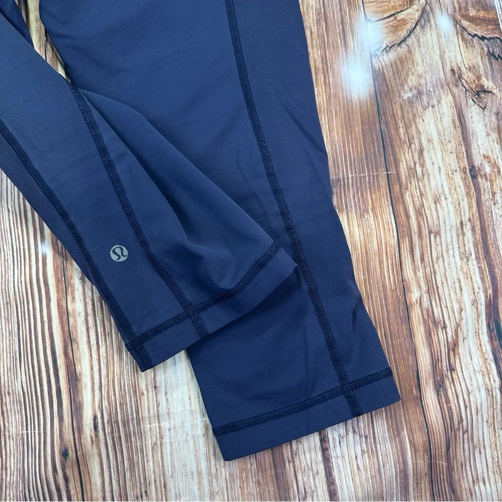 Lululemon Dark Navy ,colorful waist ban and slightly cropped leggings Size 8.